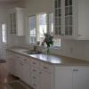 New Kitchen -Pocasset, MA- Design, custom cabinets and countertops provided-Custom White painted full overlay cabinets w/ Corian Countertops and Bead board Backsplash